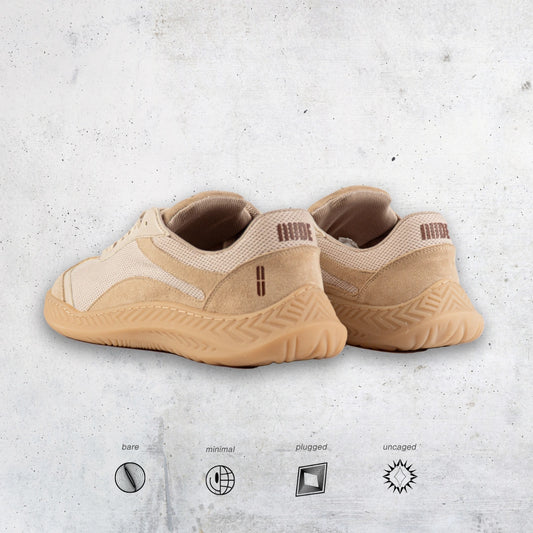 Pair of beige barefoot and minimal sneakers on a textured light gray background with brand icons at the bottom.