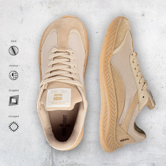 Beige barefoot and minimal sneakers on a textured gray background with brand logo.