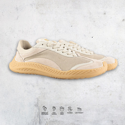 Beige barefoot and minimal sneaker with a textured sole on a light gray background