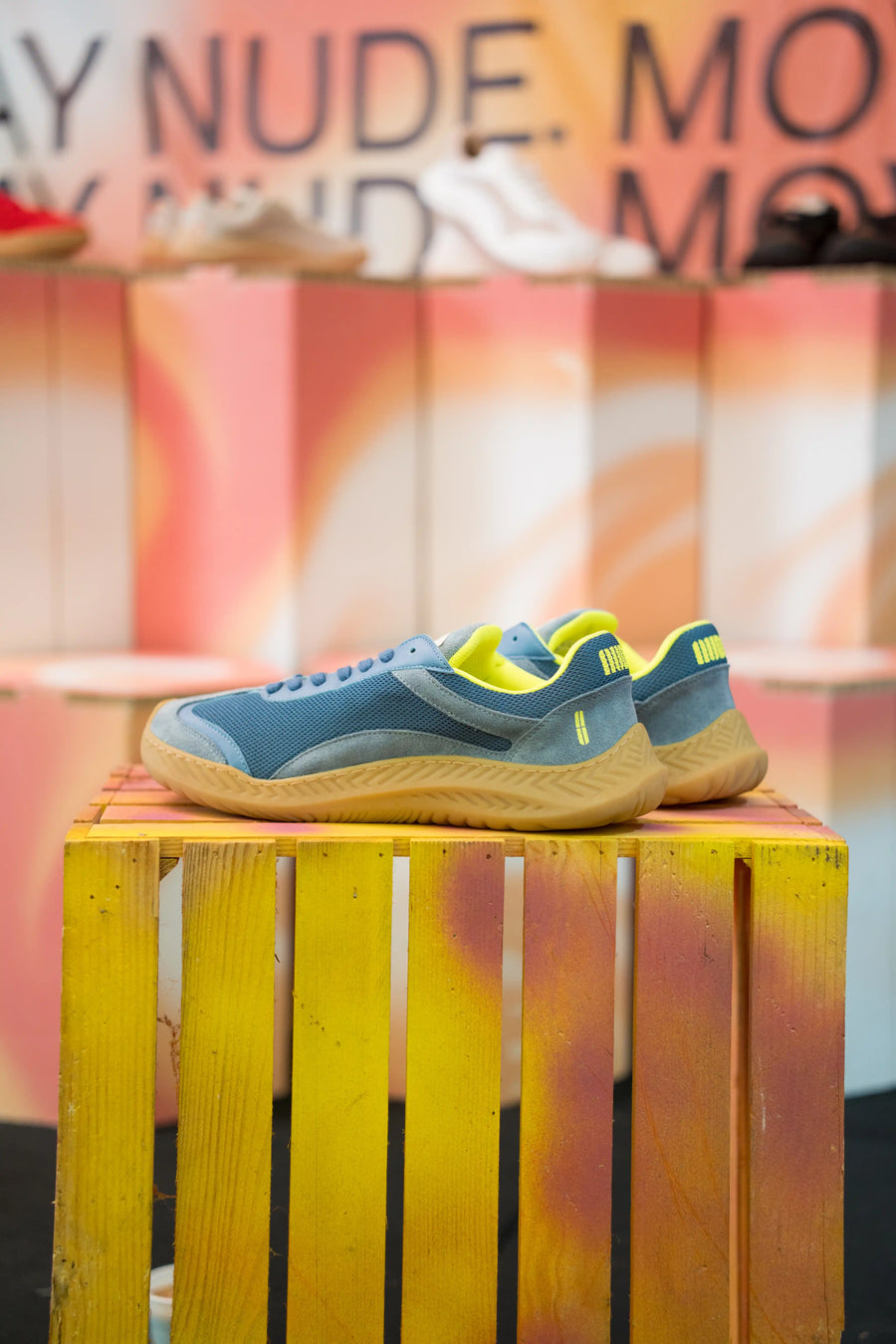 Single barefoot sneaker side view, minimalist zero-drop design in blue suede