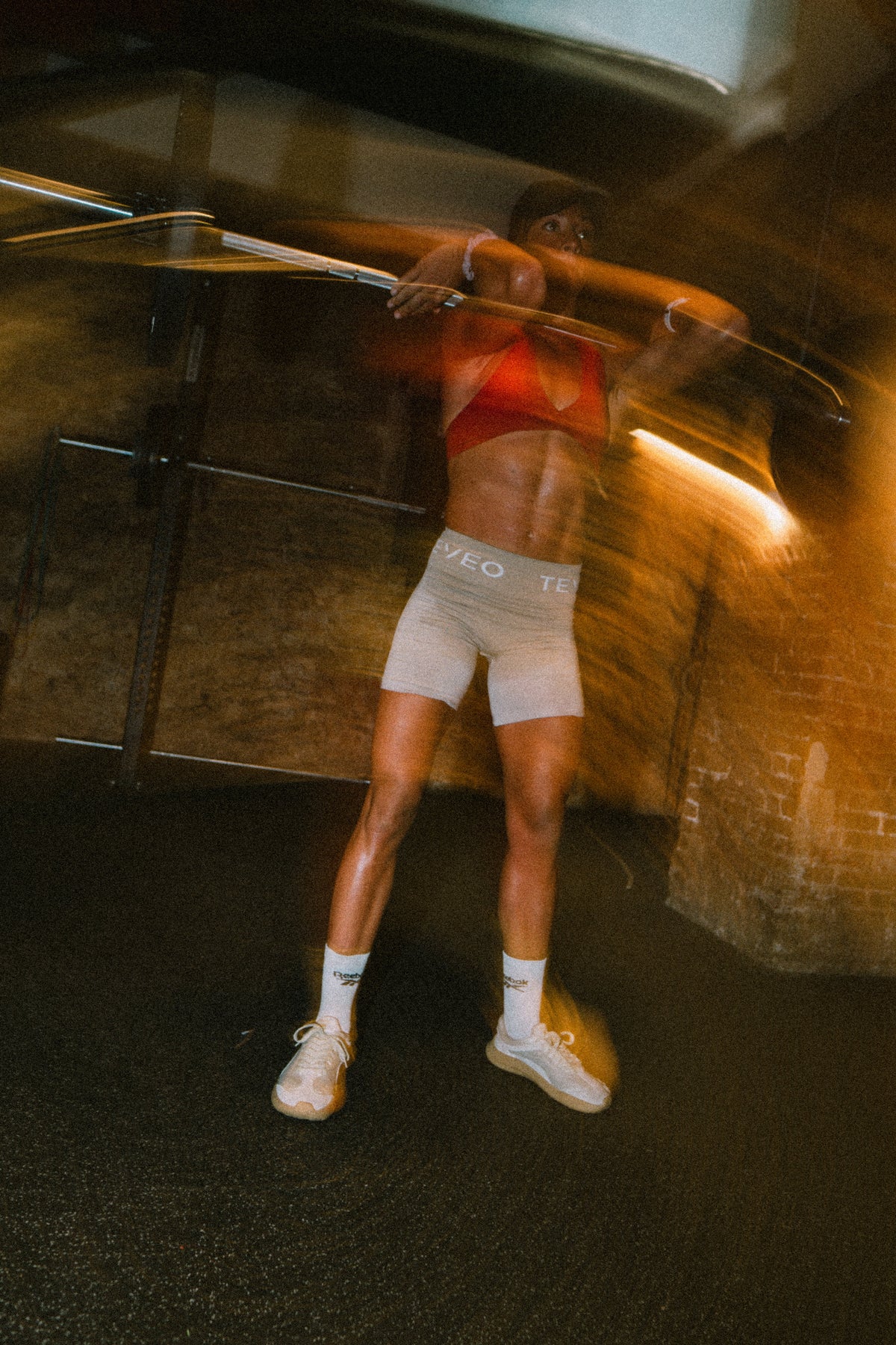 Athlete training in the gym wearing barefoot shoes