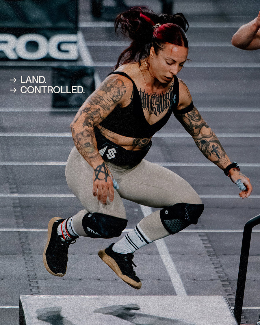 Athlete landing a box jump in The Nude Foot barefoot shoes - CrossFit Summit Spain