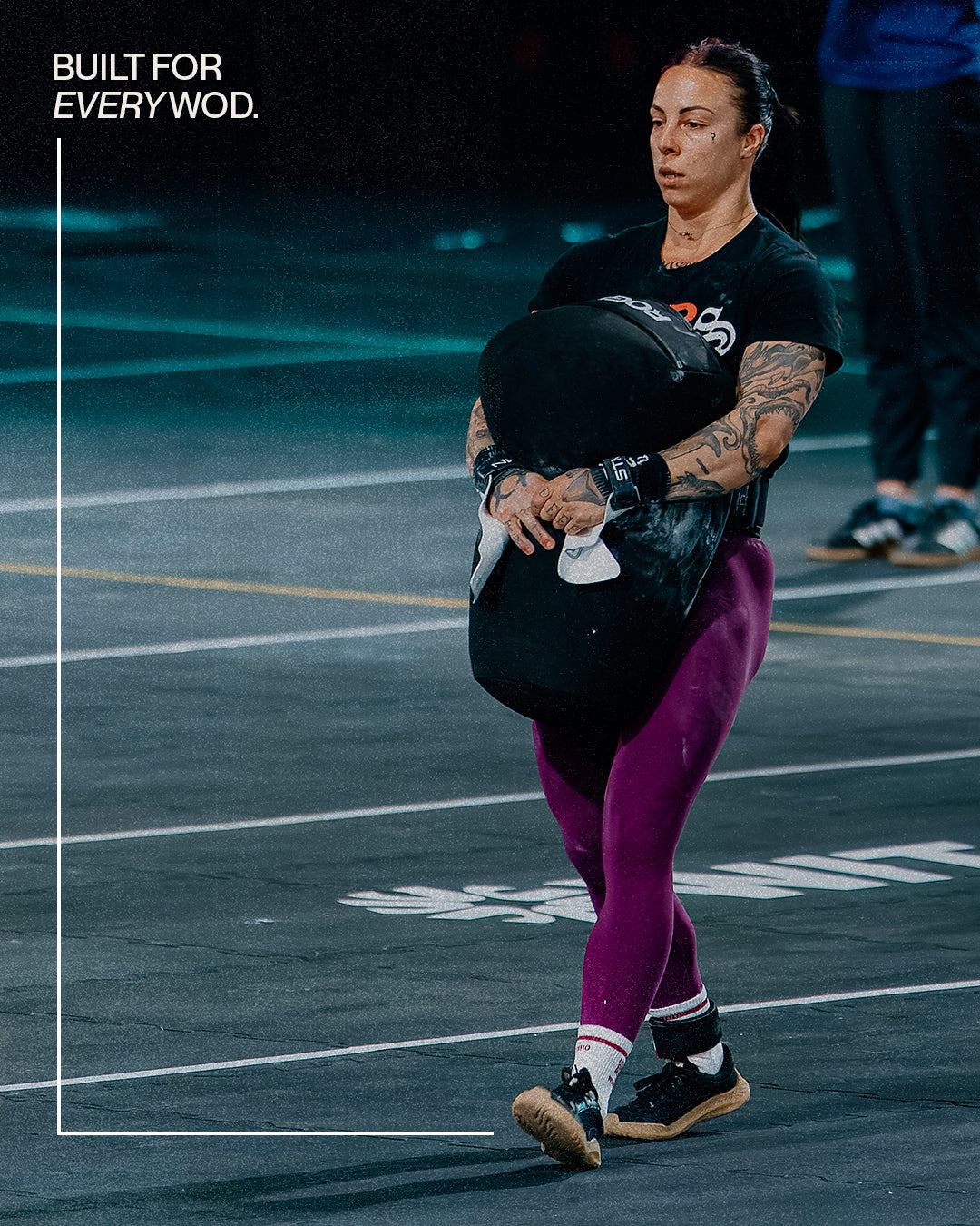 Athlete deadlifting barefoot in The Nude Foot minimalist shoes at a CrossFit box