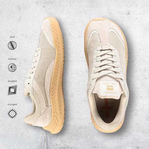 Beige barefoot and minimal sneakers with gum soles on a light gray background